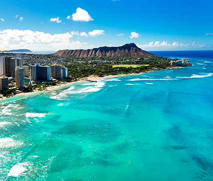 A helicopter overview of waikiki and Diamond Head in Honolulu, Hawaii.
